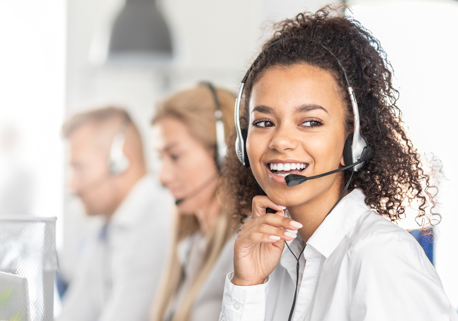 Over-the-Phone Interpreter smiling with headset