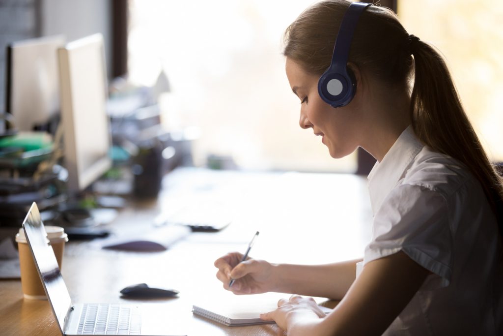 Interpreter at desk wearing headset