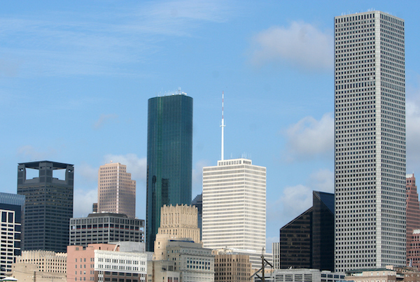 The Vietnamese Interpreter Houston Needs, represented by the Houston skyline