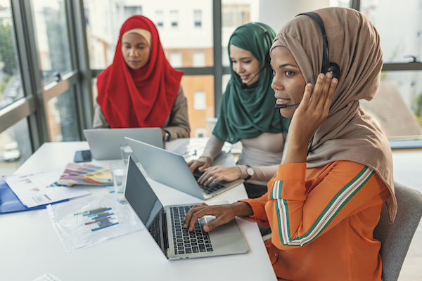 Interpreting companies in Houston represented by women at computers wearing headsets