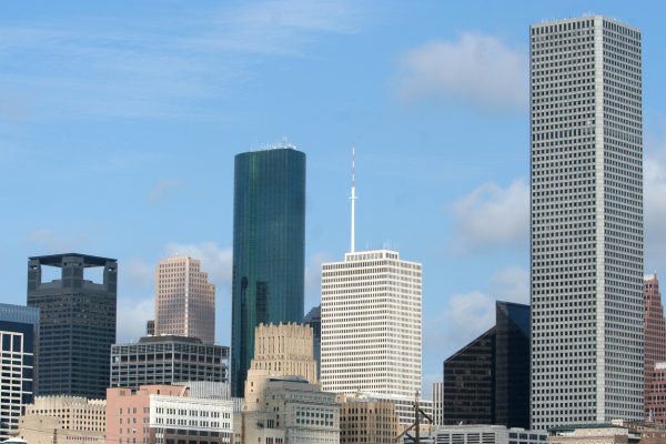 The Vietnamese Interpreter Houston Needs, represented by the Houston skyline